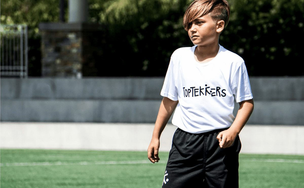 Child wearing TopTekkers logo t-shirt